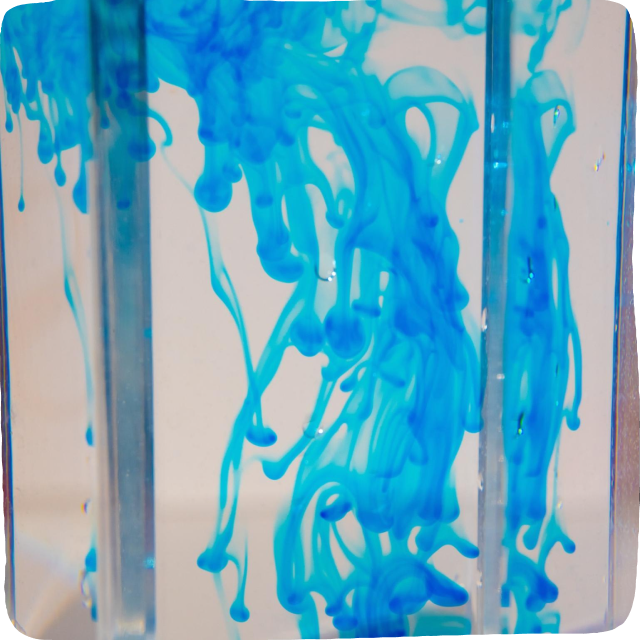 Image of a DIY water activity for kids. 
Blue colored water is sealed in a ziploc bag.