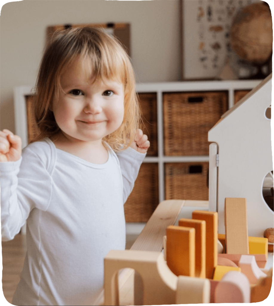 Toddler building with blocks