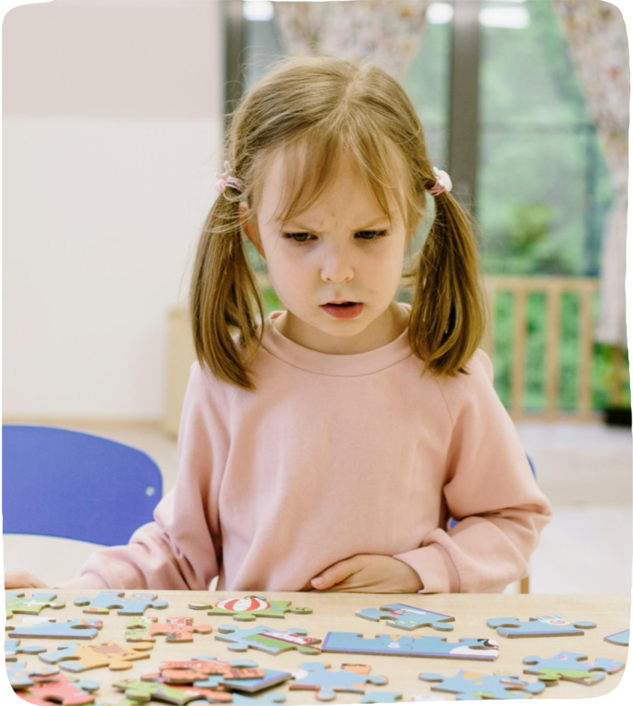 frustrated girl doing a puzzle